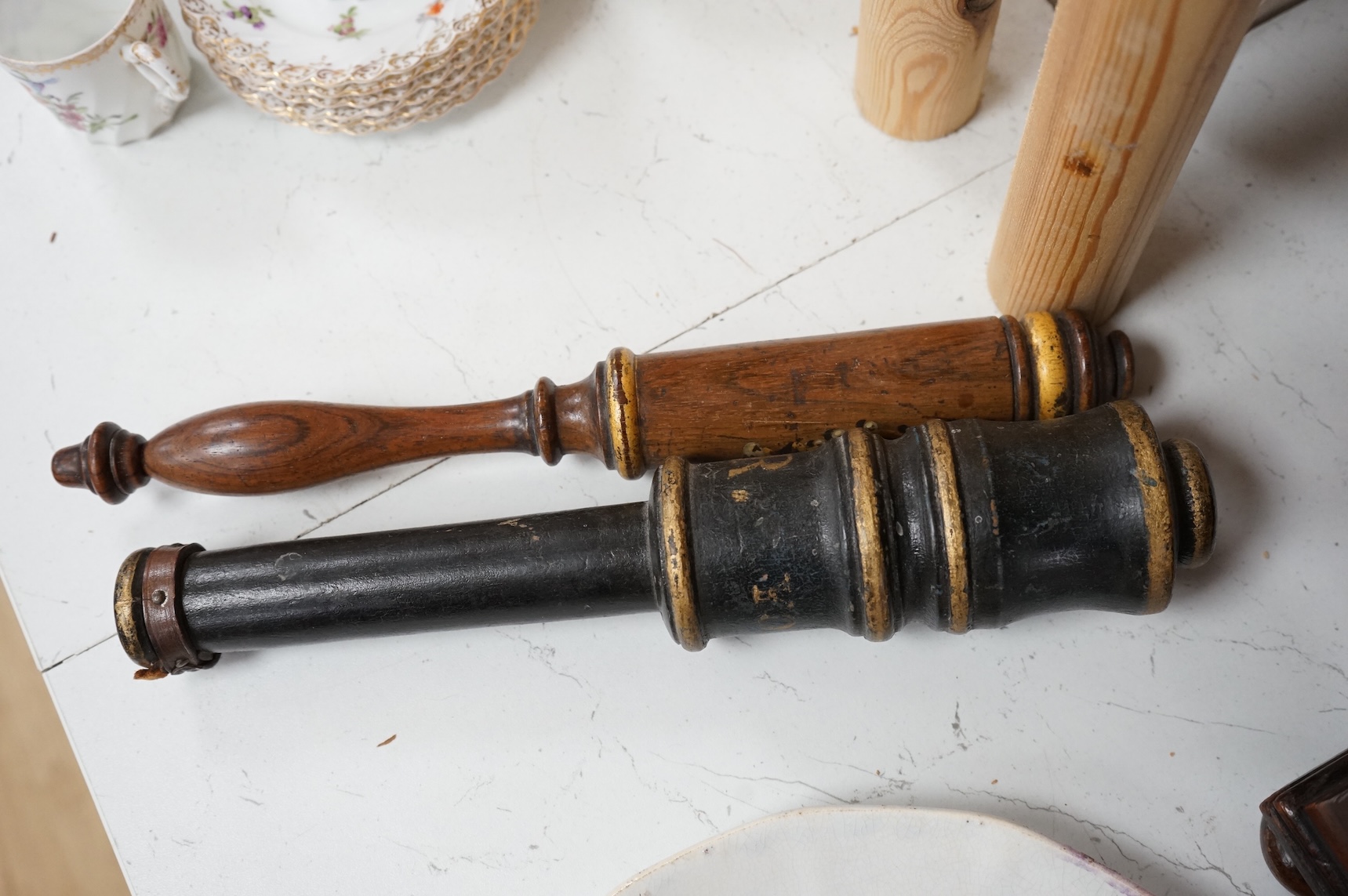 Two Victorian turned and painted wood tipstaffs, each painted with the Royal cypher, one inscribed ‘York’, largest 33cm in length